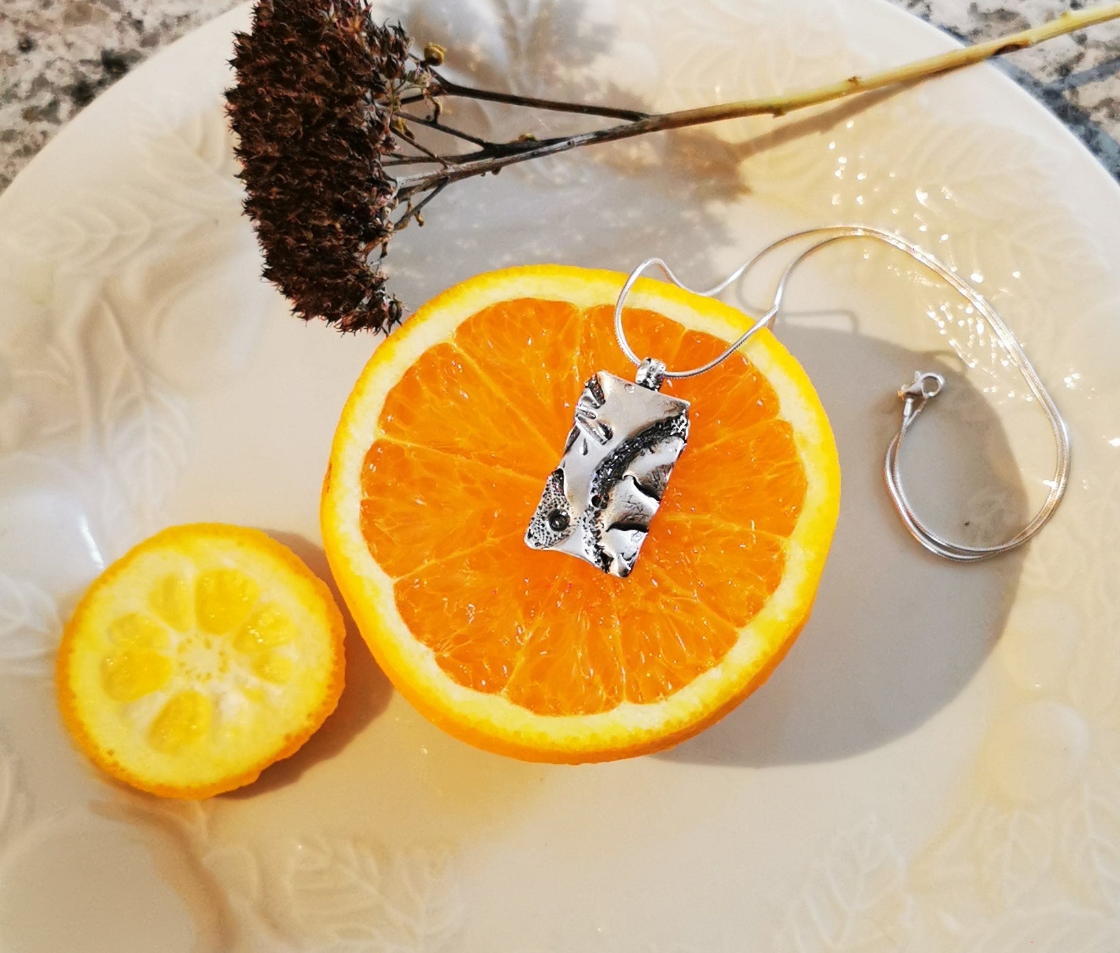 SEA CITRUS, unique pendant with a casting of an orange wedge and sea urchin shell! Handmade jewellery in Canada.
