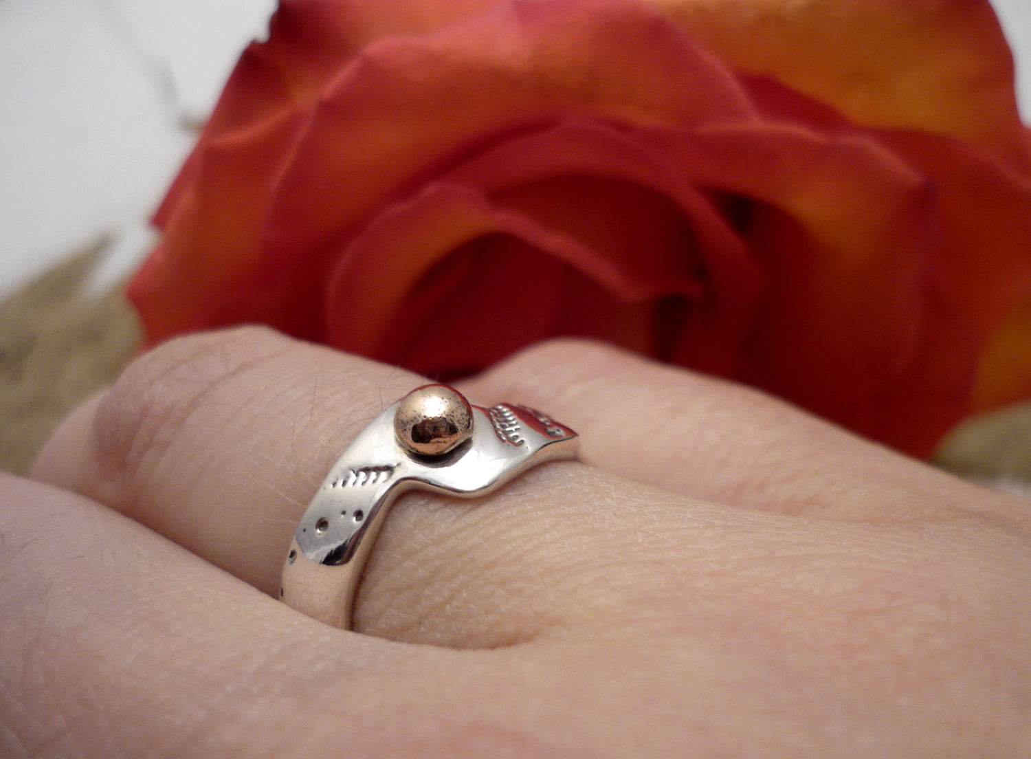 ADJUSTABLE GOLD WAVE, sterling silver ring and rose gold dot with a sea urchin shell imprint