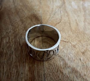 ESPRESSO RING, wide sterling silver ring with coffee bean imprints.