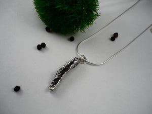 CANTALOUP PEEL, elongated pendant made from cantaloupe peel cast in sterling silver