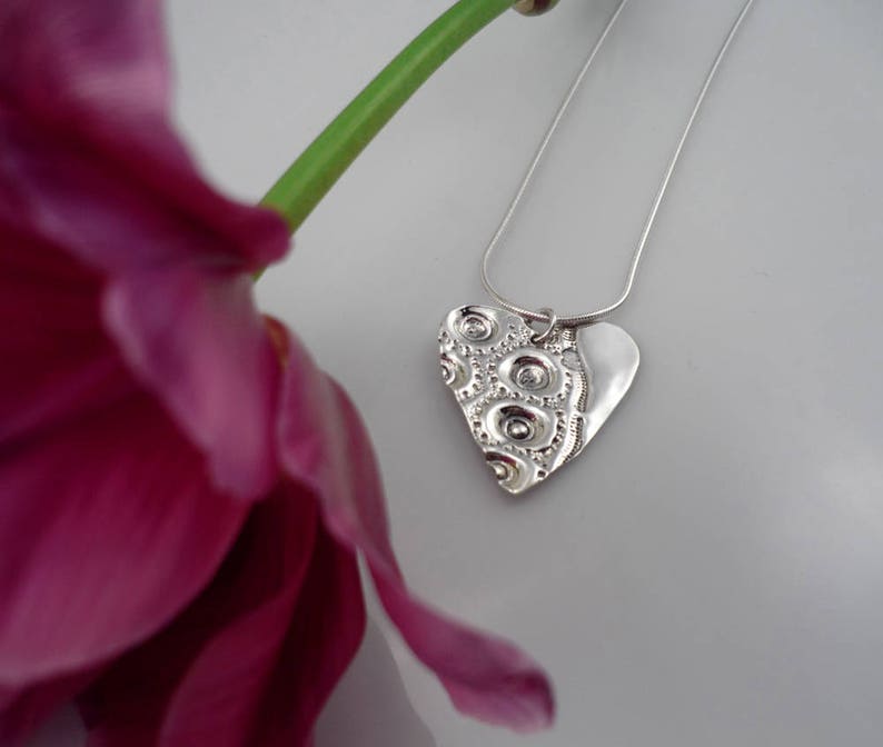 LARGE HEART, sterling silver pendant with a sea urchin shell imprint.