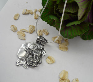GOOD MORNING PENDANT, original pendant made from a mold of real cantaloupe peel and oat flakes