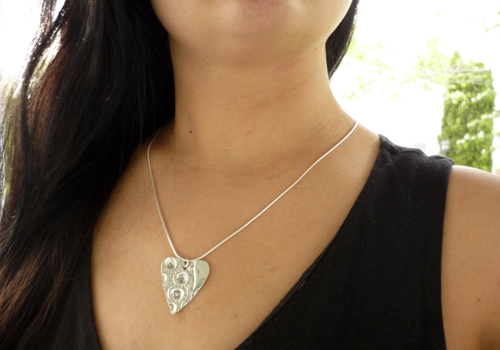 LARGE HEART, sterling silver pendant with a sea urchin shell imprint.