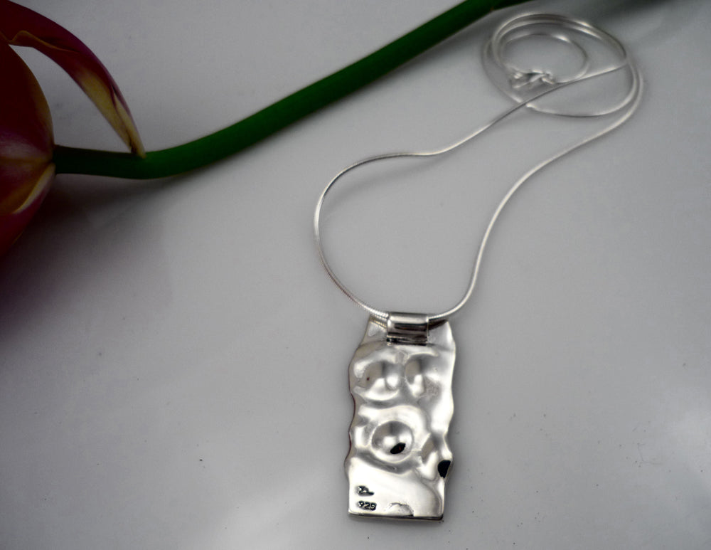 LARGE EKHINOS, sterling silver pendant with a imprint of a sea urchin shell.